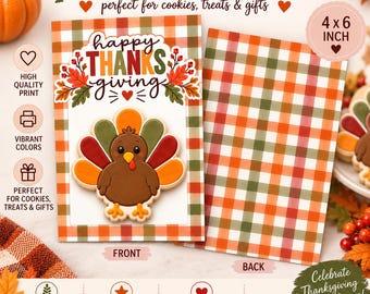 May include: A 10.16 x 15.24 cm rectangular cookie backer card with a Thanksgiving theme. The front displays a brown turkey illustration with colourful feathers and the text Happy Thanksgiving. Both sides feature an orange, green, and white plaid pattern.