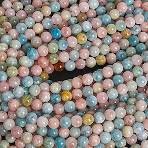 May include: Strands of round gemstone beads in a variety of pastel colors, including pink, blue, green, and yellow. The beads are strung together with pink thread, creating a natural and colorful look. Ideal for jewelry making.