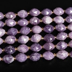 May include: A strand of purple gemstone beads with a faceted, oval shape. The beads are strung on a wire with gold-colored spacers between each bead.