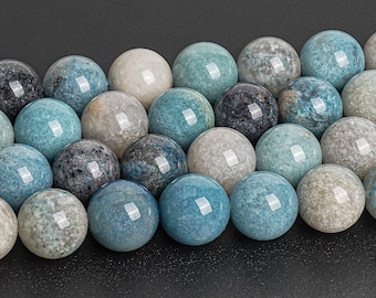 May include: A collection of round, smooth, blue, gray, and white gemstone beads. The beads are arranged in a row and are all approximately the same size.