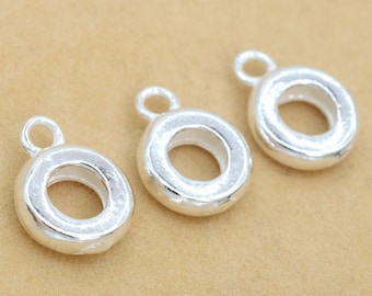 May include: Three silver-toned metal ring-shaped jewelry findings with a small loop at the top. The rings are smooth and have a slightly rounded edge.