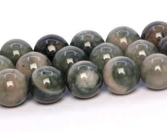 May include: A strand of round, green and grey gemstone beads. The beads have a mottled, swirling pattern.