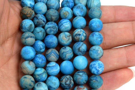 Pietra Pazza Blu Ruzzolata Dell'agata Del Pizzo Su Bianco Fotografia - Foto 6