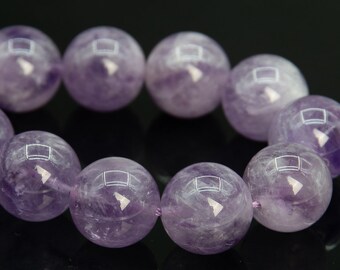 May include: A strand of amethyst beads, each bead is a deep purple color and has a smooth, polished finish.