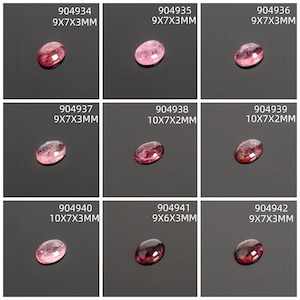 May include: Nine oval-shaped gemstones in varying shades of pink and red, displayed on a dark surface. Each stone has a unique internal pattern. The dimensions of each stone are listed above each gemstone in millimeters.