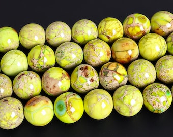 May include: A collection of round, polished beads featuring a vibrant lime green base color with intricate, web-like brown and tan veining throughout. Each bead displays a smooth, glossy surface with natural variations in color intensity and pattern.
