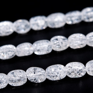 May include: A strand of clear, oval-shaped beads with a textured, crystalline appearance. The beads are strung together on a clear thread.