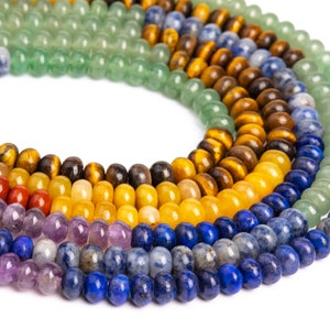 May include: A close-up of a multi-coloured beaded necklace with various gemstone beads, including green, yellow, orange, red, purple, and blue.