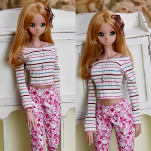 May include: A set of three ceramic mugs with a speckled, matte finish. The mugs are in shades of cream, light gray, and dark gray. Each mug has a simple, minimalist design and a rounded handle.