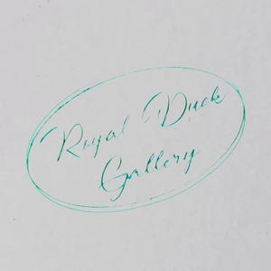May include: An image of the words "Royal Duck Gallery" written in cursive script inside a teal oval on a white background. The text is in a teal color.