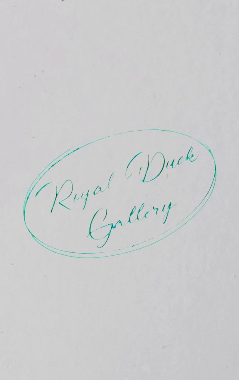 May include: An image of the words "Royal Duck Gallery" written in cursive script inside a teal oval on a white background. The text is in a teal color.