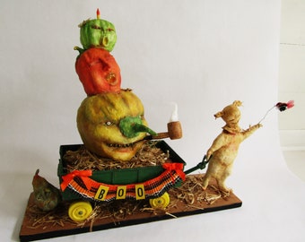 Nostalgic Folk Art Carol Roll, mixed media paper mache ghoul with wagon of pumpkins Halloween decor