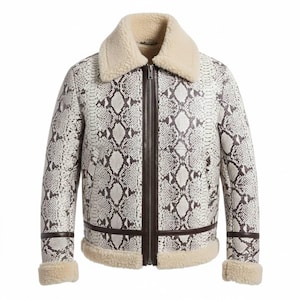 May include: A white and brown snakeskin-patterned jacket with a cream-colored shearling collar and trim. The jacket features a front zipper closure and brown leather accents. The sleeves have shearling cuffs.