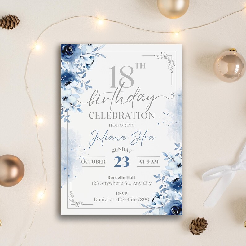 May include: An invitation for an 18th birthday celebration. The design features a white background with blue floral accents and text. The invitation includes the name "Juliana Silva", the date, time, and location, and an RSVP contact.