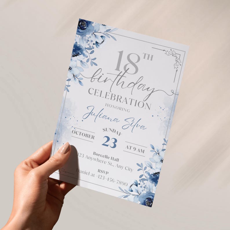 May include: An invitation for an 18th birthday celebration. The invitation features a floral design in shades of blue and white. The text includes the words "18th birthday celebration" and the name "Juliana Silva". The date is October 23rd.