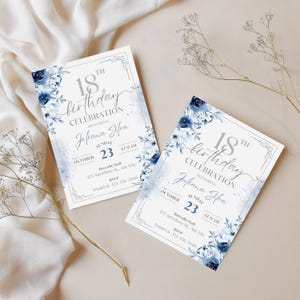 May include: Two invitations for an 18th birthday celebration. The invitations feature a white background with blue floral accents and text. The text includes the name "Juliana Silva", the date, time, and RSVP information.