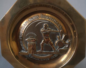 Vintage Solid Brass Blacksmith Ashtray – “Triumphans” Made in England – Heavy Industrial Man Cave Decor – 6.5 Inch