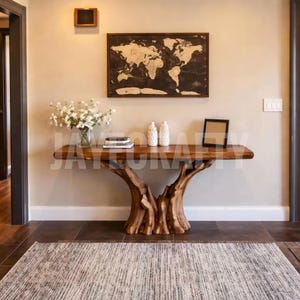 May include: A wooden console table with a natural, tree-trunk-inspired base. The tabletop is a warm brown, and the table is adorned with decorative items, including vases, books, and a framed picture. A world map hangs on the wall above the table.