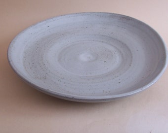 Serving or fruit bowl. With speckled white  glaze.