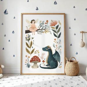 A whimsical watercolor illustration featuring a gentle fairy with golden wings sitting on a tree branch, a friendly teal dragon, red spotted mushrooms, and various botanical foliage against a light background.