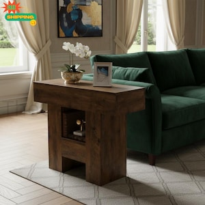 May include: A dark brown wooden console table with a rectangular top and a lower open shelf. The table features a smooth finish and a sturdy base. A white orchid in a patterned bowl and a small framed picture sit on the top surface.