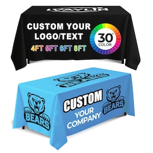 May include: Two custom table covers are displayed. The top one is black with white text that reads "CUSTOM YOUR LOGO/TEXT" and "4FT 5FT 6FT 8FT". The bottom one is light blue with "CUSTOM YOUR COMPANY" and a bear logo.