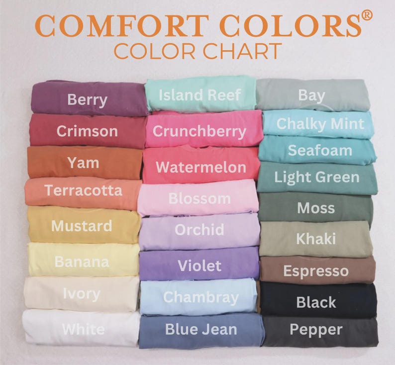 May include: A color chart displaying a variety of Comfort Colors t-shirts. The chart features a range of colors, including Berry, Crimson, and Mustard. The text "COMFORT COLORS COLOR CHART" is at the top.