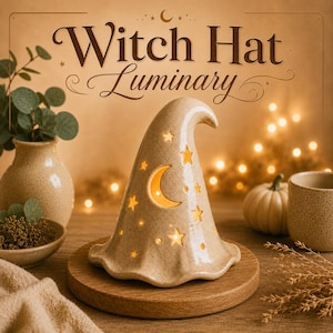 May include: A beige ceramic witch hat luminary featuring cutouts of a crescent moon and various stars. The surface has a speckled texture and emits a warm internal glow. The text Witch Hat Luminary is displayed above the object in brown font.