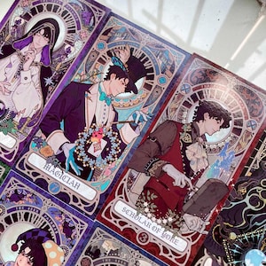 May include: A collection of tarot cards featuring illustrations of figures in ornate attire. The cards have a stained-glass window design with the words "Magician" and "Scholar of Yore" visible. The color palette includes purple, blue, and gold.