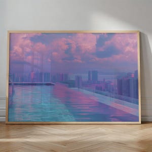 May include: A framed art print featuring a rooftop pool with a city skyline backdrop. The water reflects the pink and purple hues of the sky and clouds. The artwork is encased in a light-colored wooden frame, creating a serene and modern aesthetic.