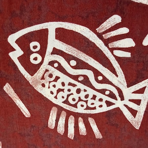 Funny fish print from Alexander Henry on rust cotton, one yard