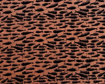 Black batik fish on pale coral cotton