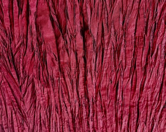 Dark wine colored heat set pleated rayon/nylon taffeta fabric piece