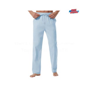 May include: Light blue linen pants with a drawstring waist. The pants are a relaxed fit and suitable for yoga or casual wear. The image also includes the text "Men's Linen Pants Summer Yoga Beach Wide Fit".