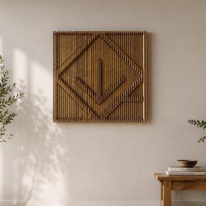 May include: A square wall art piece constructed from numerous vertical wooden slats. The slats are arranged to form a geometric diamond pattern with a central downward-pointing arrow shape, creating a textured, three-dimensional relief effect.