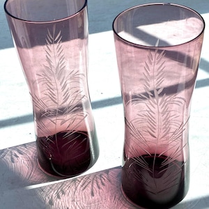 May include: A set of three ceramic mugs with a speckled, matte finish. The mugs are in shades of cream, light gray, and dark gray. Each mug has a simple, modern design and a rounded handle. Perfect for coffee or tea.