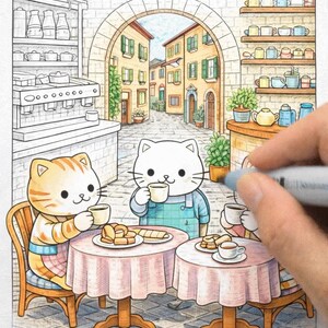 May include: A colouring book illustration of three cartoon cats at a cafe, drinking coffee. The cats sit at small tables with pink tablecloths, with pastries and coffee cups. The background shows a European street scene.