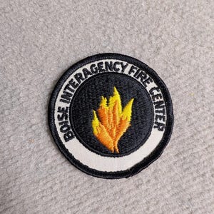 May include: A rustic wooden sign with the text "Welcome to our home" in white lettering. The sign features a distressed finish and a simple, inviting design, perfect for front door decor.