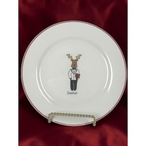 May include: A set of three ceramic mugs with a speckled, matte finish. The mugs are in shades of cream, light gray, and dark gray. Each mug has a simple, minimalist design, perfect for coffee or tea.