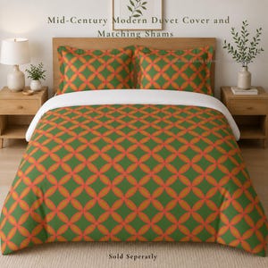 May include: Mid-Century Modern duvet cover and matching shams set. The bedding features a green background with a repeating pattern of orange interlocking circles. The text "Sold Separately" is at the bottom.