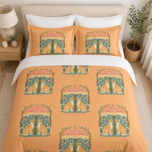 May include: A bed set featuring a repeating pattern of two cheetahs under a decorative umbrella. The set includes a duvet cover and two pillowcases, all in a warm orange hue. The cheetahs have spots and are set against a teal background.