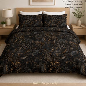 May include: A dark tropical leopard duvet cover and matching shams featuring a black and brown pattern of leopard spots and large tropical leaves. The text Dark Tropical Leopard Duvet Cover and Matching Shams and Sold Seperatly is visible.