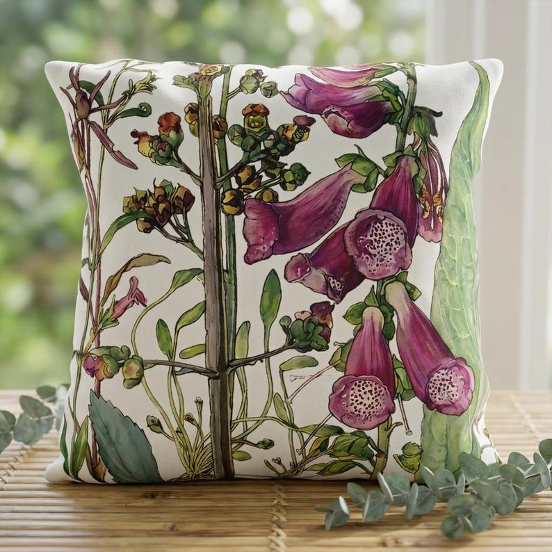 May include: A square throw pillow featuring a botanical illustration on a white background. The design displays tall green stems with clusters of deep purple and magenta foxglove flowers, featuring speckled interiors and green foliage.