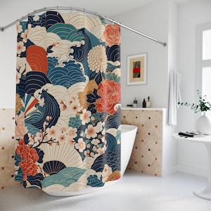 May include: A shower curtain featuring a repeating pattern of dark blue stylized ocean waves, large orange and cream peony flowers, white cherry blossoms, and fan shapes. The design incorporates a palette of navy, cream, orange, and teal colors.
