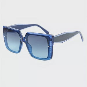 May include: Blue square sunglasses with a gradient lens. The frames are a translucent blue, and the arms are a darker blue. The lenses transition from a lighter blue at the bottom to a darker blue at the top.