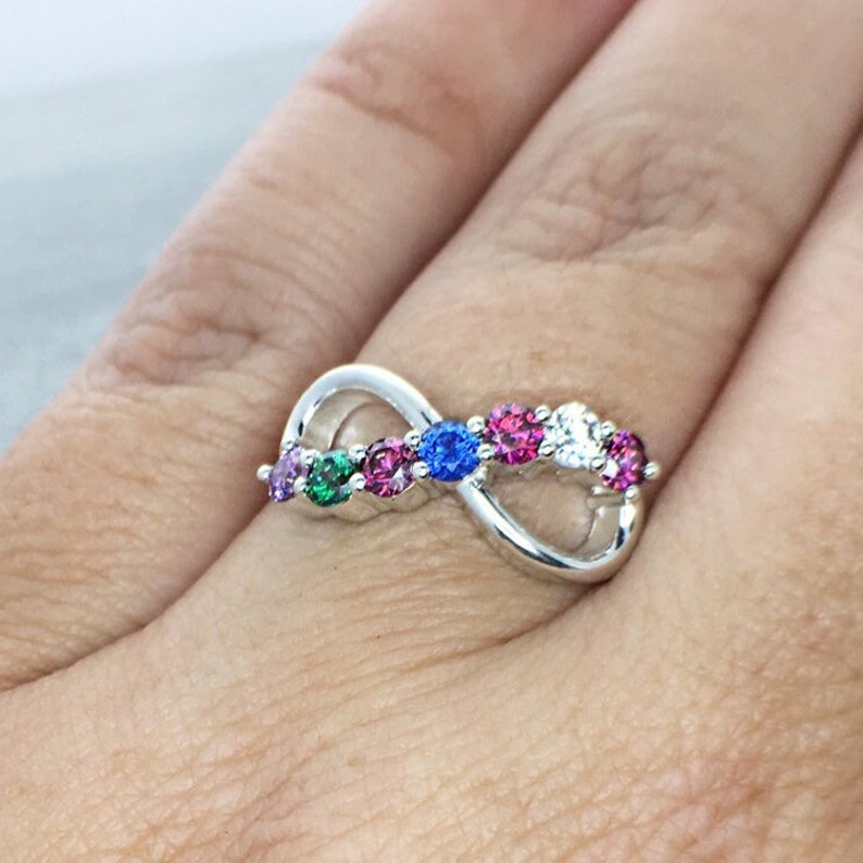 Family birthstone ring in an infinity design and multiple colored stones