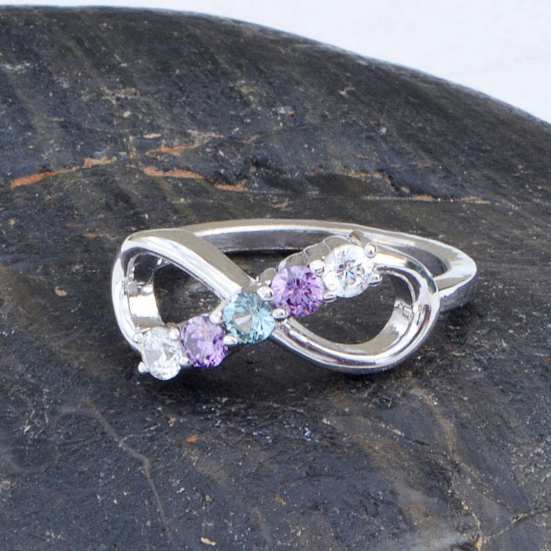 Five stone ring with an infinity shape, sterling silver