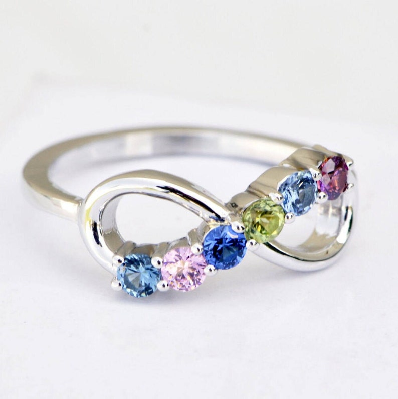 Birthstone ring with an infinity design, set with 6 round birthstones