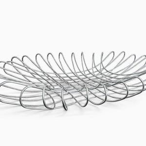 May include: A modern, oval-shaped metal wire basket. The basket is made of shiny, silver-colored wire, with a series of curved loops forming the sides. The open design allows for air circulation, making it suitable for storing fruits or other items.