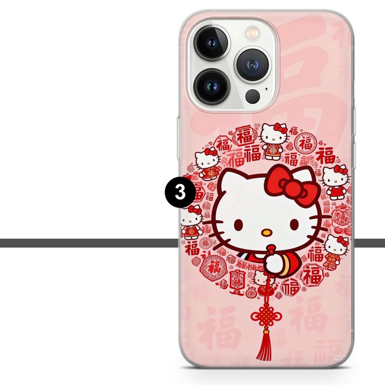 May include: Pink phone case featuring a Hello Kitty design with a red bow. The case has a repeating pattern of the word "Fu" and small Hello Kitty figures. A red tassel hangs from the bottom.